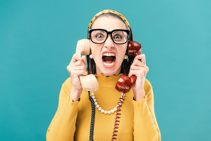 Lady stressed by two phone calls