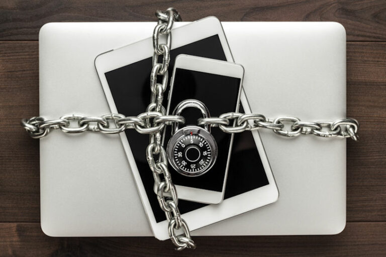 A computer, tablet, and phone locked together.